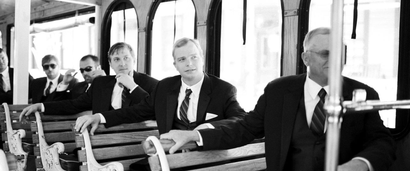 a group of people sitting on a bench