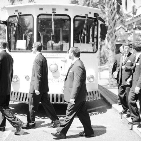 a group of people standing around a bus
