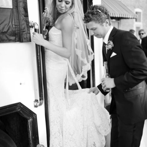 a man and a woman standing next to a window