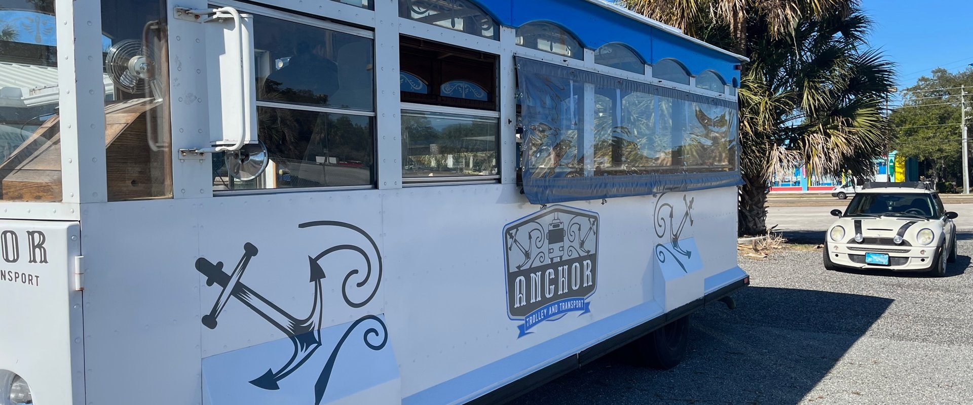 a passenger bus that is parked on the side of a road